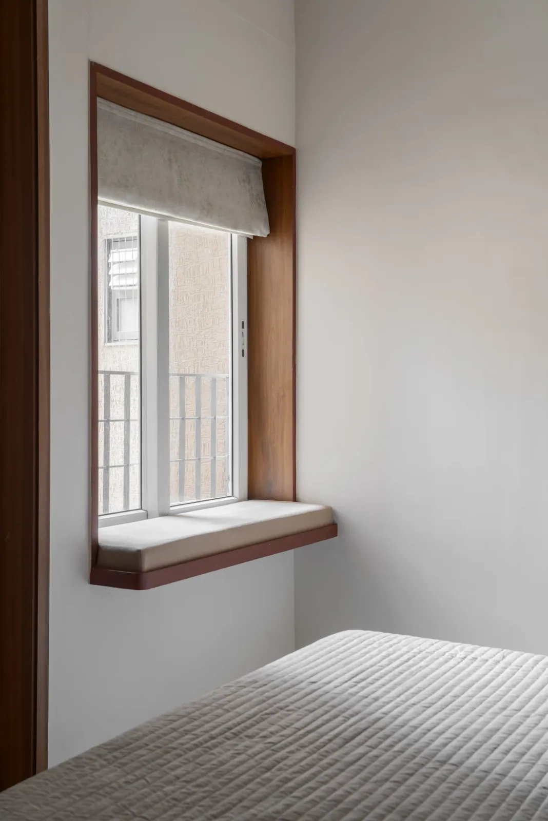 Bedroom window seat at Anand Nilay, Sarthya West, interior design by Ekaya Design Studio