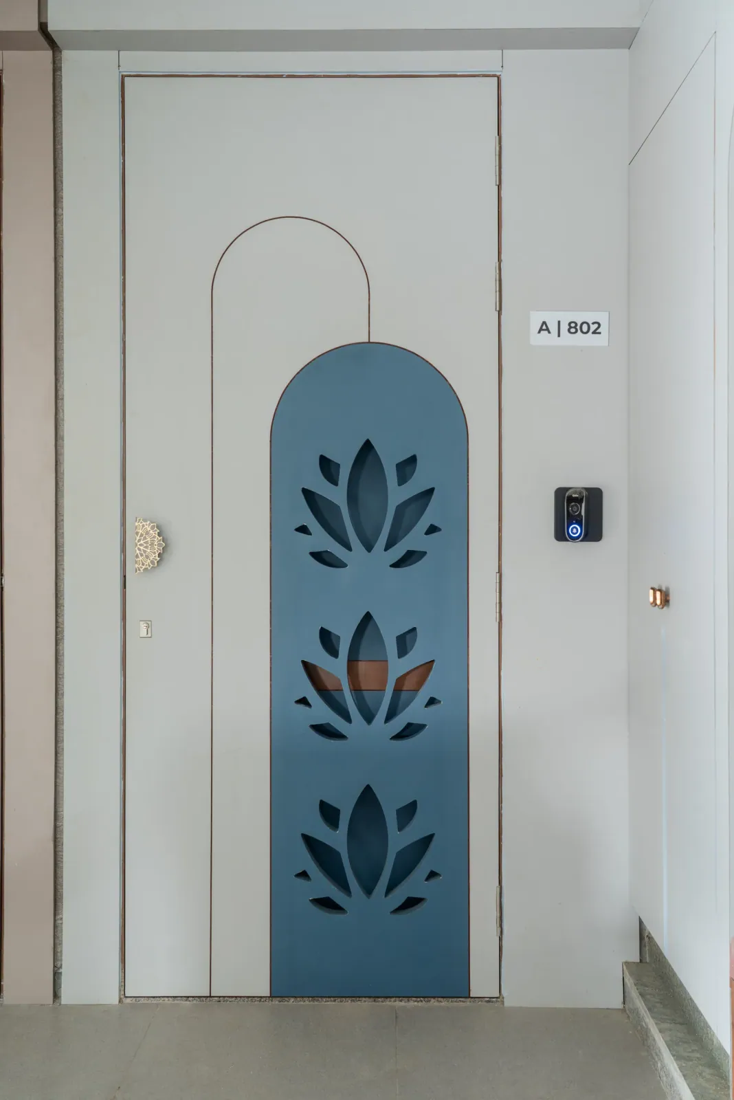 Entrance door at Anand Nilay, Sarthya West, interior design by Ekaya Design Studio