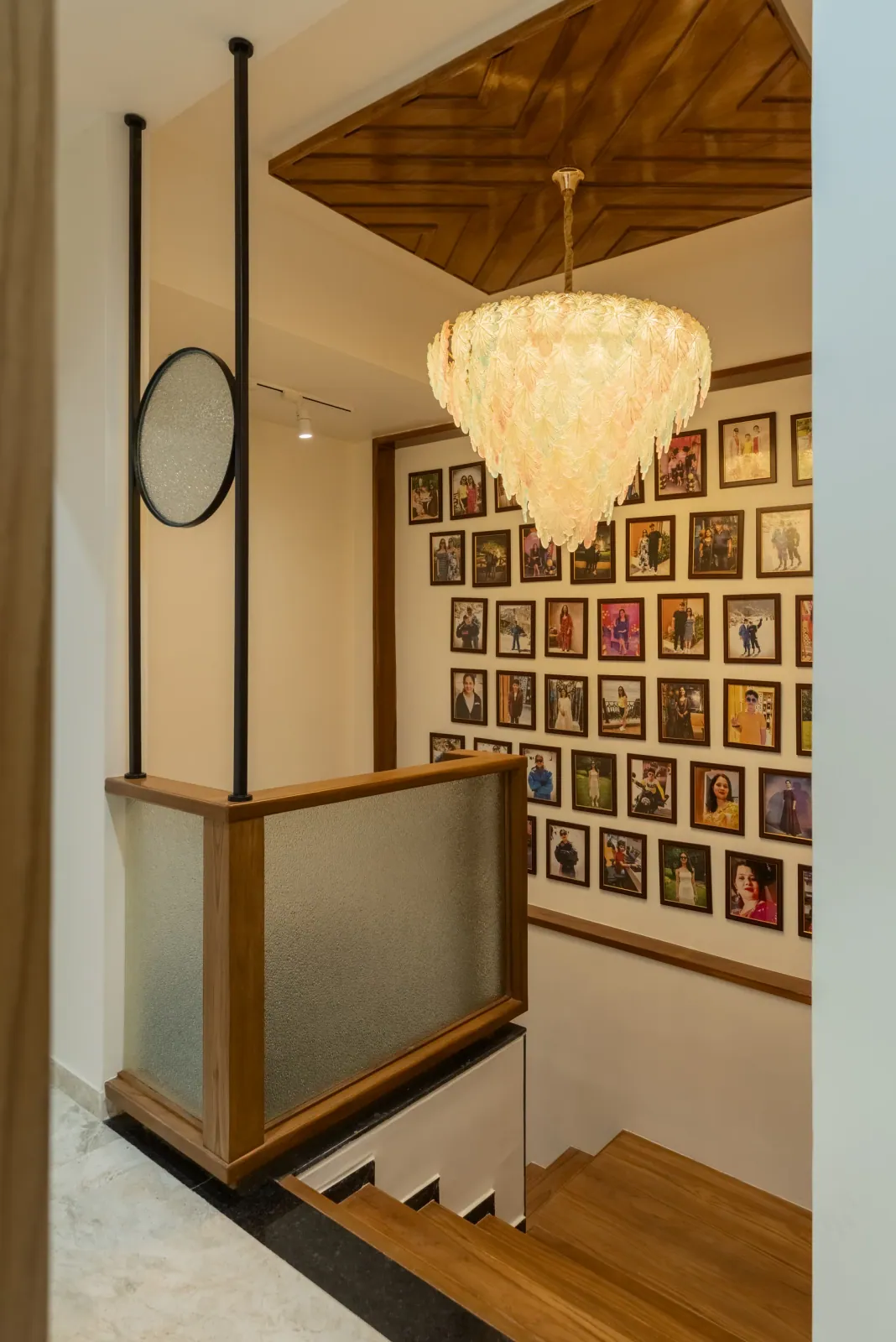 Staircase landing with photo wall at Bouganville, interior design by Ekaya Design Studio
