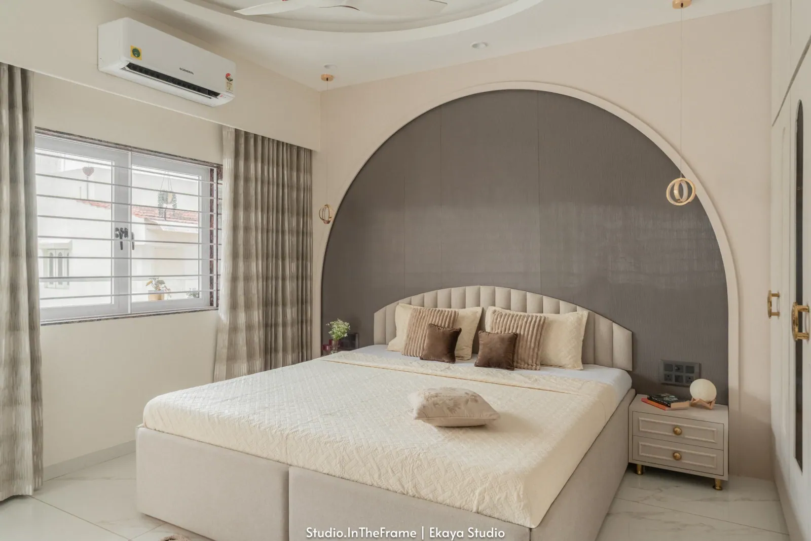 Bedroom with arched headboard at Krishna Park, interior design by Ekaya Design Studio