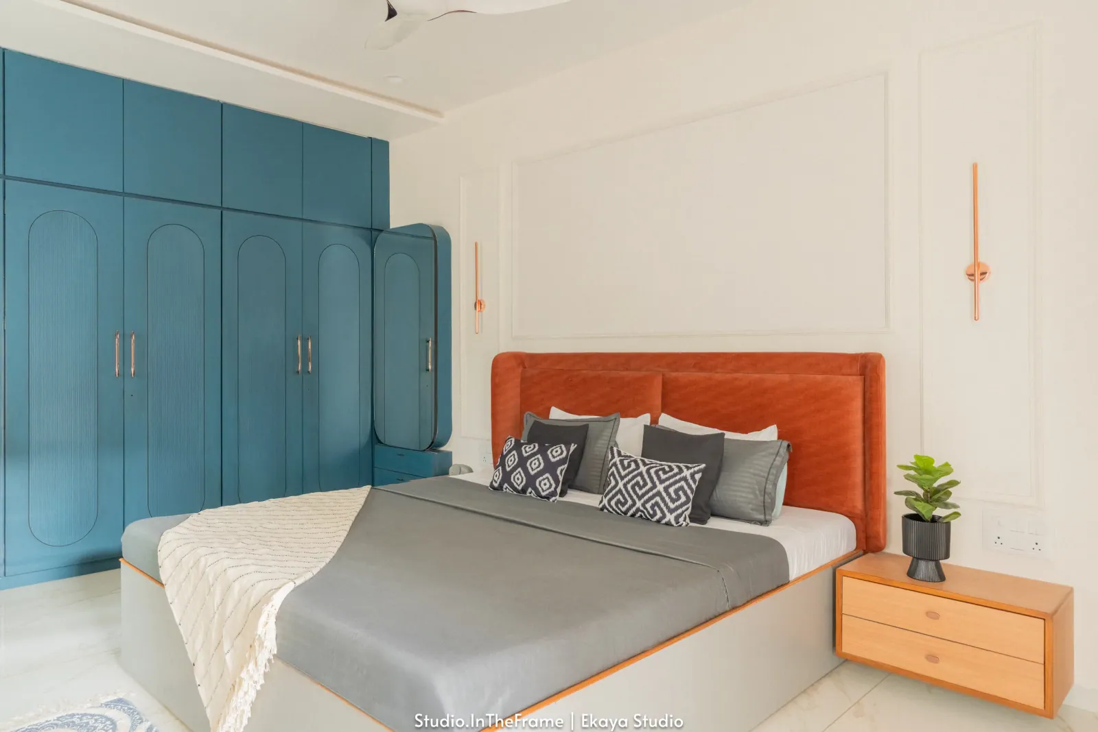 Bedroom with teal wardrobes at Krishna Park, interior design by Ekaya Design Studio