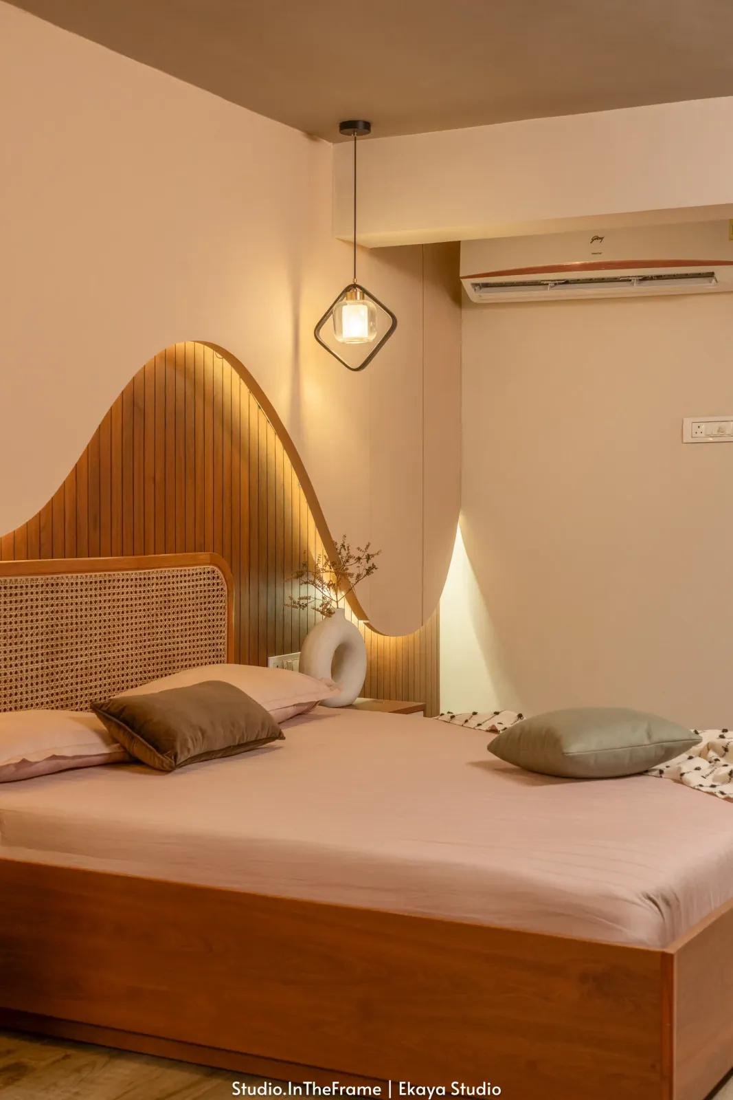 Bedroom with sculpted headboard at Pushkar, interior design by Ekaya Design Studio