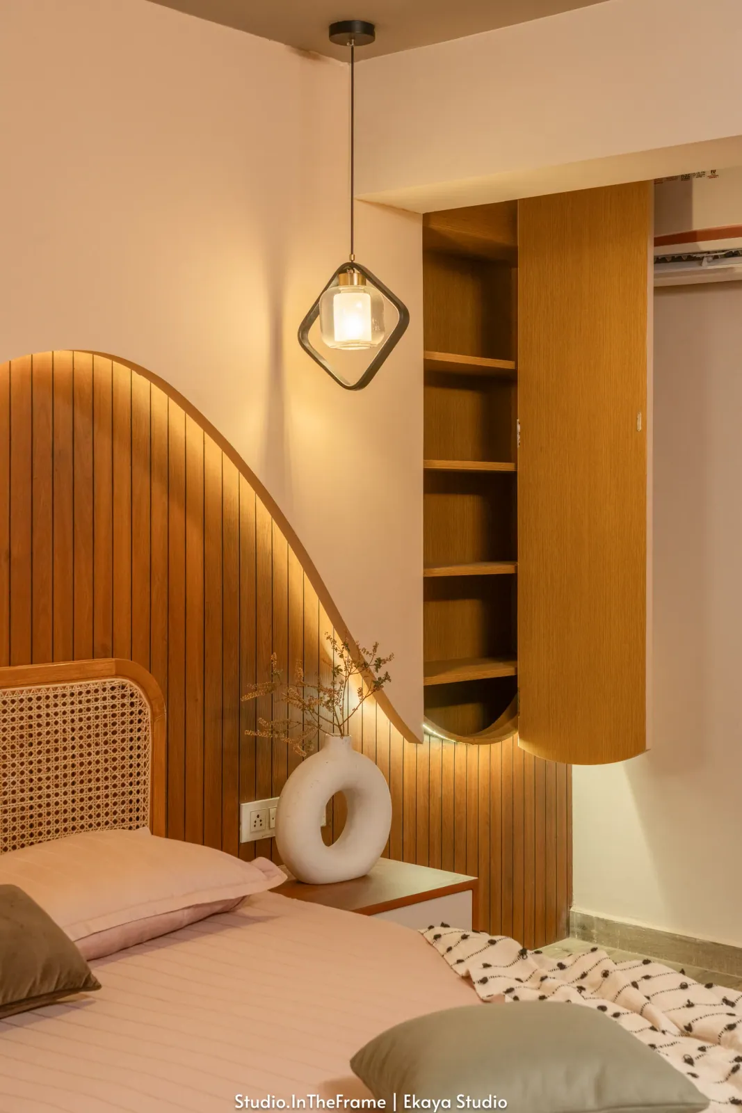 Bedroom with sculpted headboard at Pushkar, interior design by Ekaya Design Studio