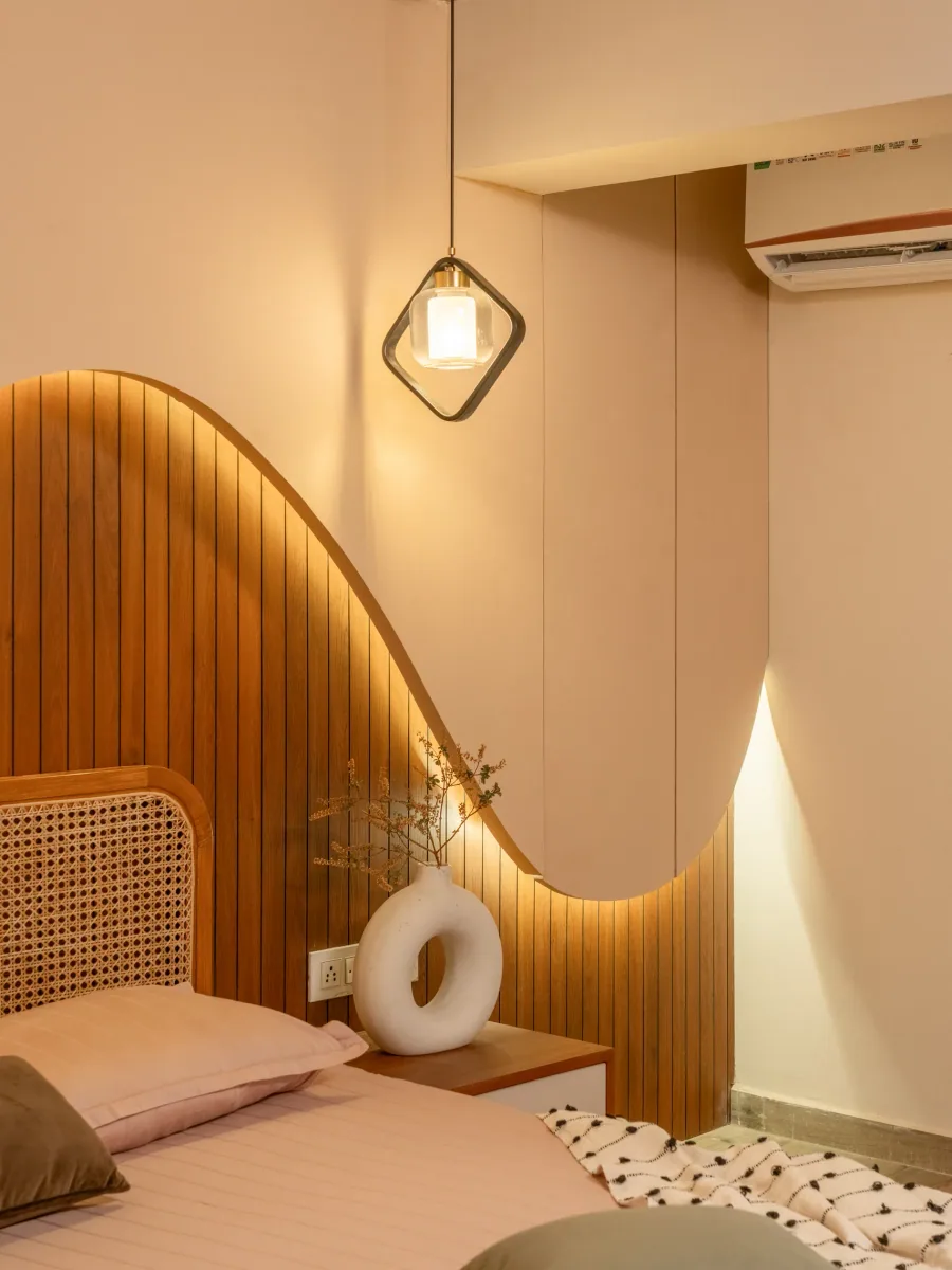 Bedroom with sculpted headboard at Pushkar, interior design by Ekaya Design Studio