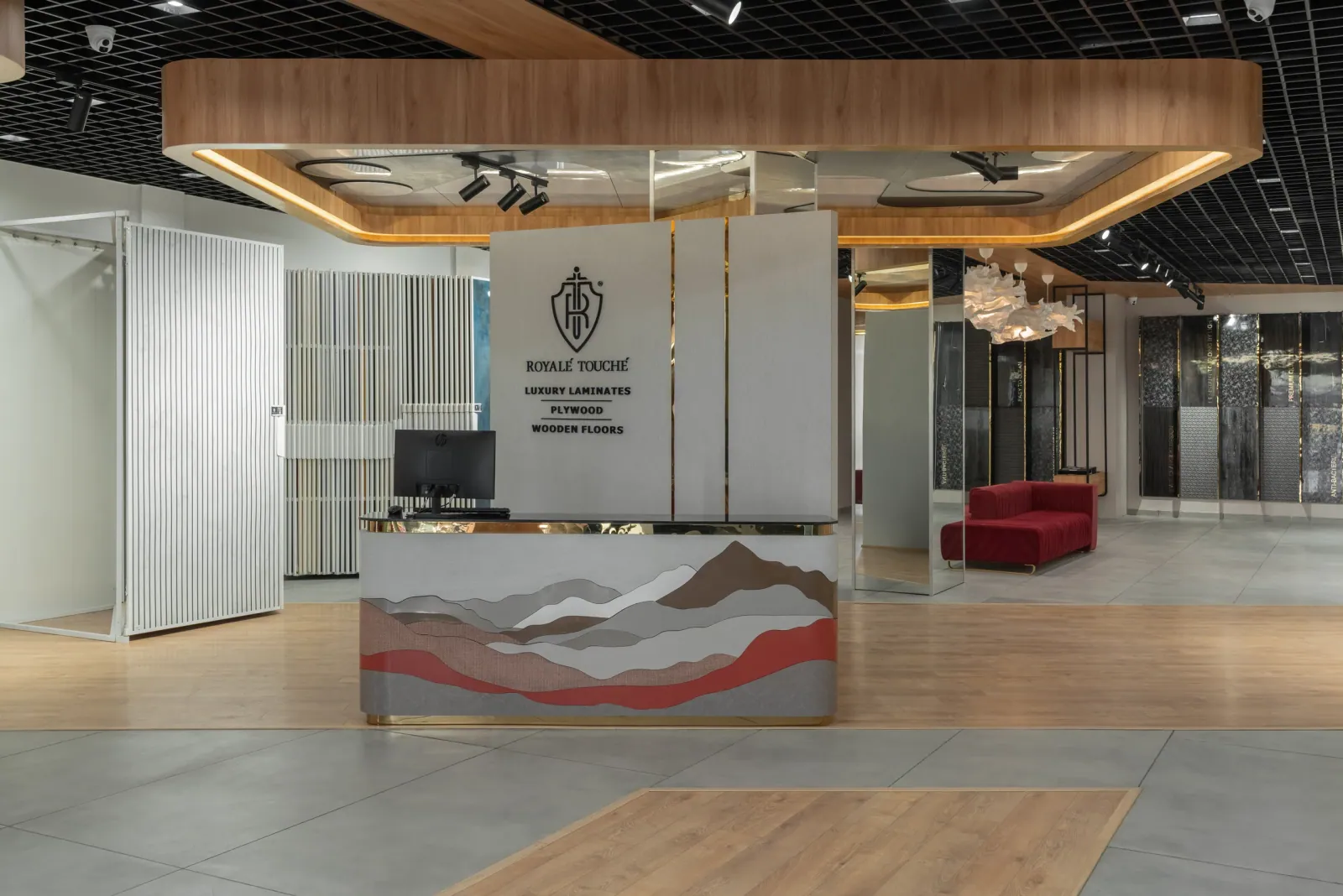 Reception desk at Royale Touche Showroom, Palanpur, interior design by Ekaya Design Studio