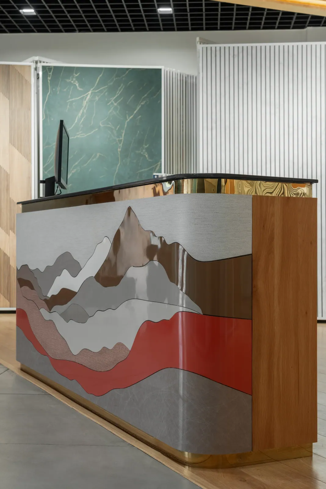 Reception desk at Royale Touche Showroom, Palanpur, interior design by Ekaya Design Studio