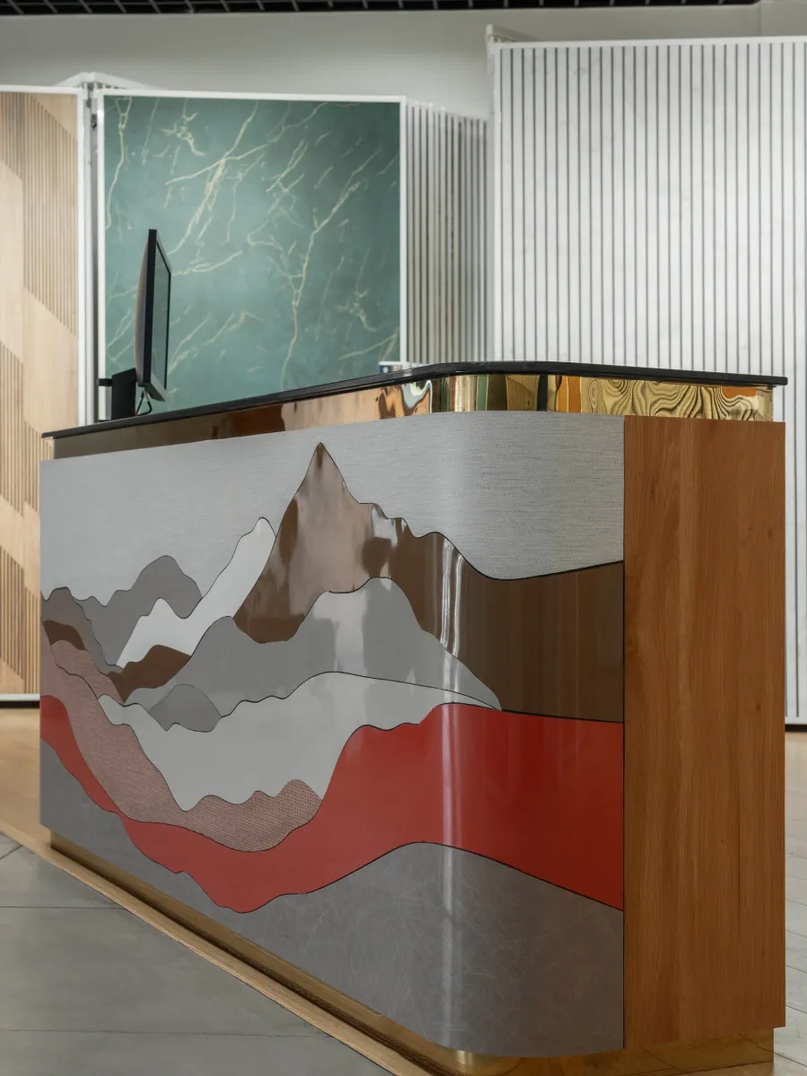 Reception desk at Royale Touche Showroom, Palanpur, interior design by Ekaya Design Studio