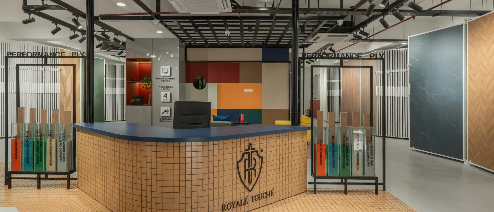 Reception desk at Royale Touche Showroom, Porbandar, interior design by Ekaya Design Studio
