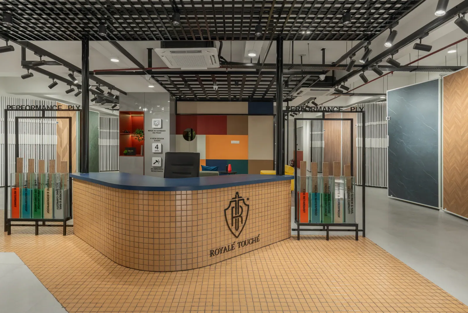 Reception desk at Royale Touche Showroom, Porbandar, interior design by Ekaya Design Studio