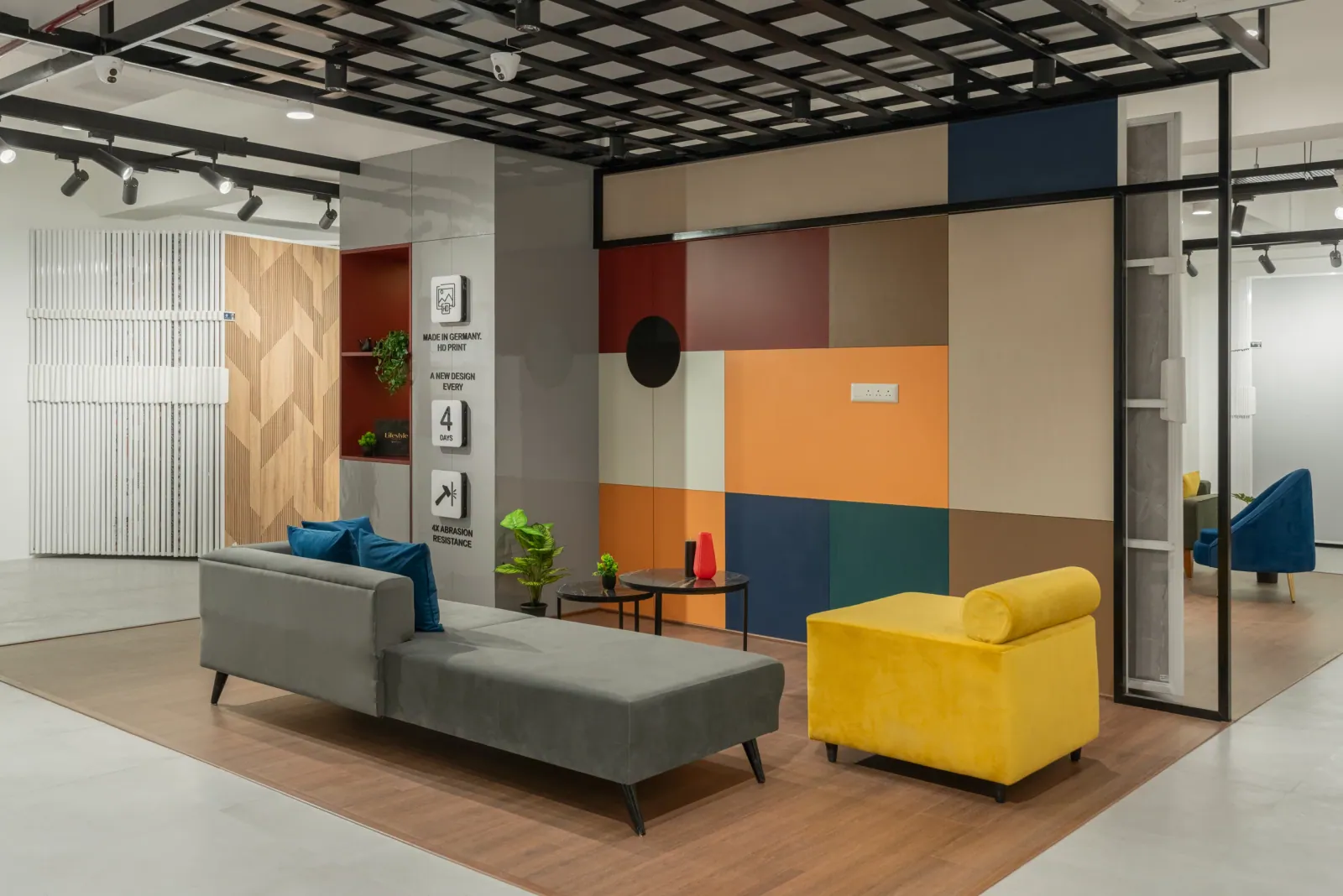 Lounge seating at Royale Touche Showroom, Porbandar, interior design by Ekaya Design Studio