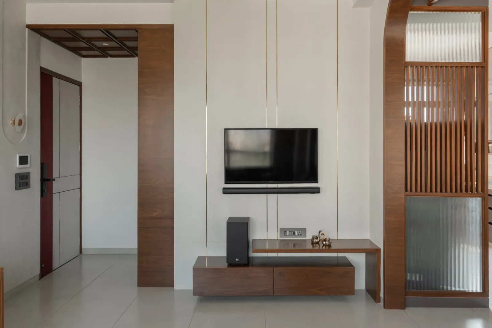 Living room TV unit at Satyamev Serene, interior design by Ekaya Design Studio