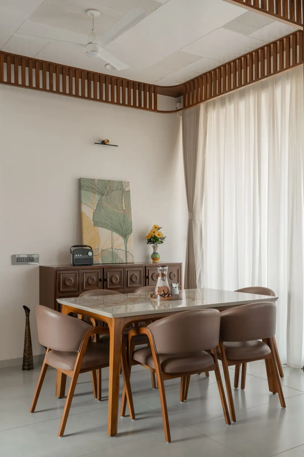 Dining area at Satyamev Serene, interior design by Ekaya Design Studio
