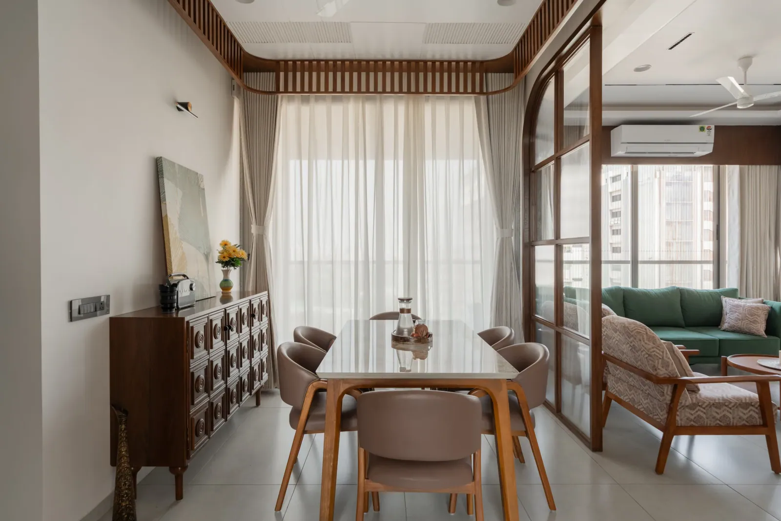 Dining area at Satyamev Serene, interior design by Ekaya Design Studio