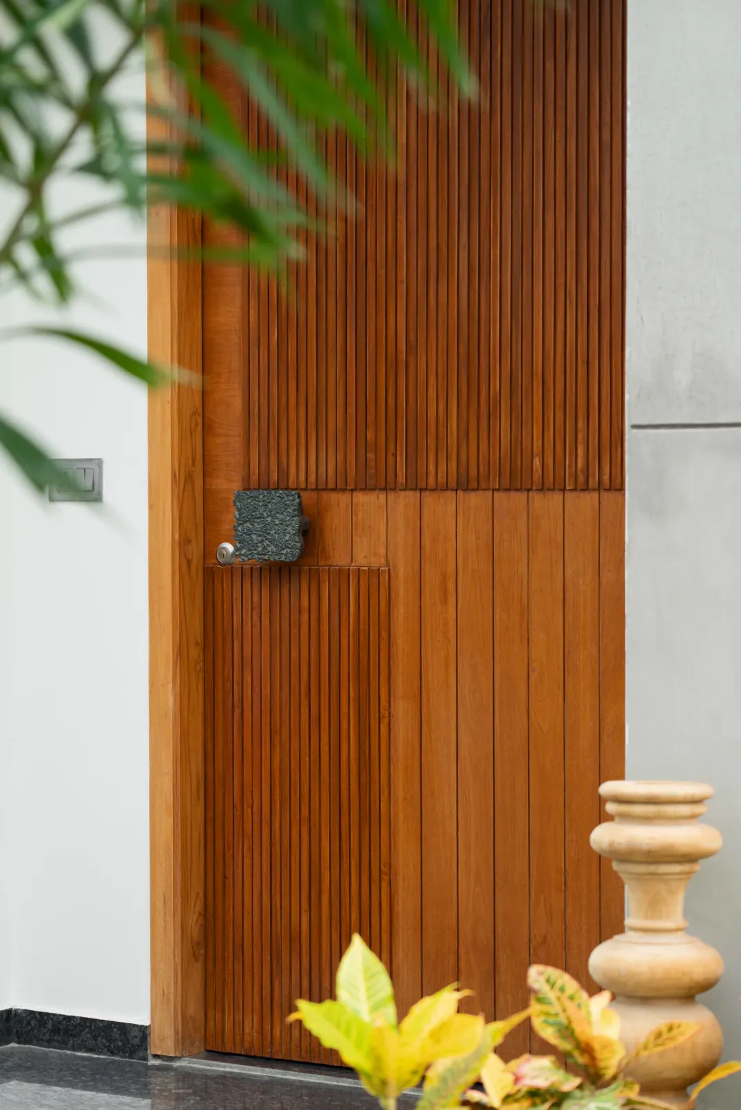 Entrance door at Shreeya Kromme, interior design by Ekaya Design Studio