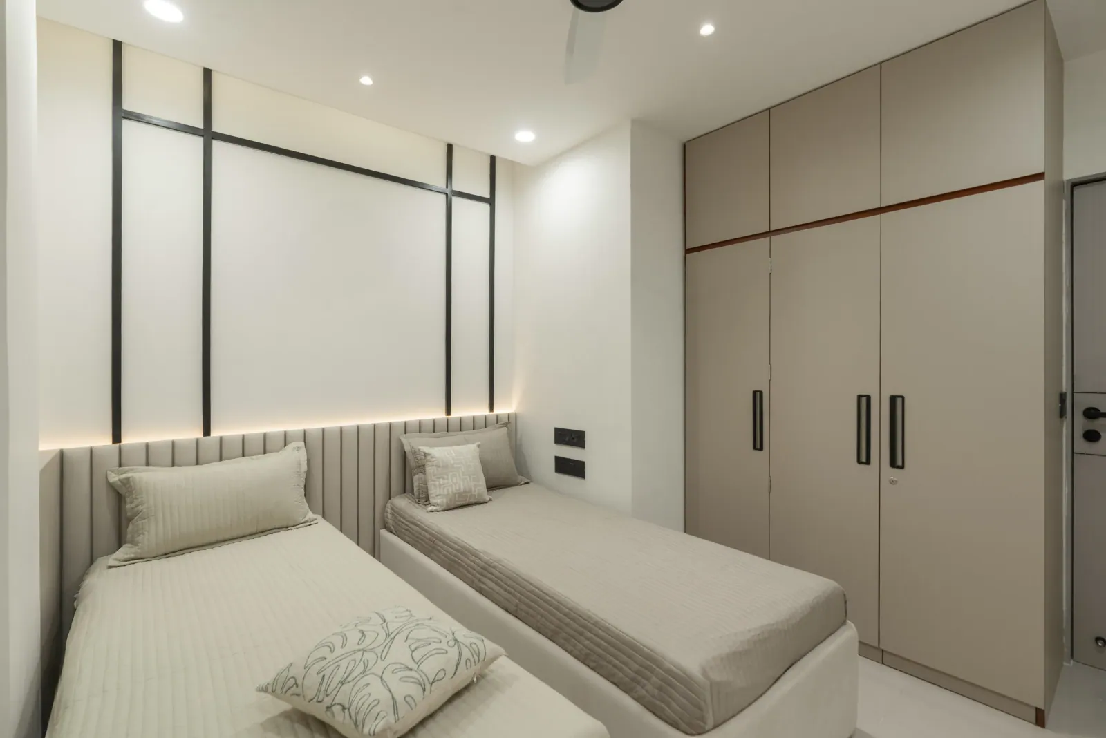 Bedroom with twin beds at Suryavanshi, interior design by Ekaya Design Studio