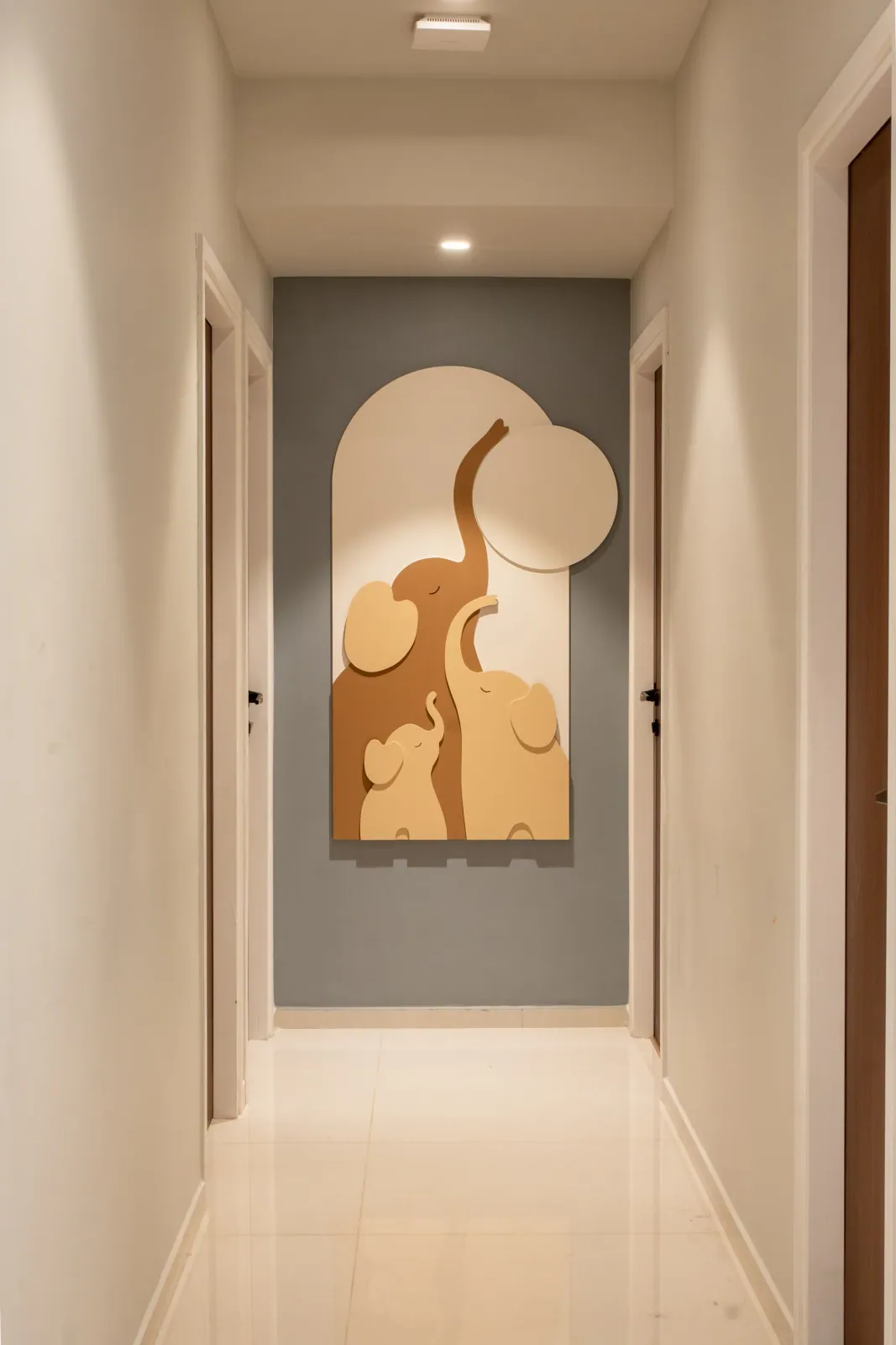 Corridor with art niche at Swati Parkside, interior design by Ekaya Design Studio